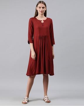 textured a-line dress with tassels