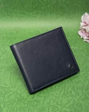 textured bi-fold wallet with pinmount logo