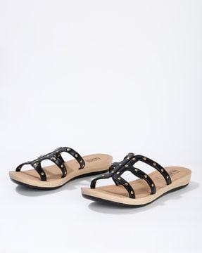 textured flat sandals with metal rivets