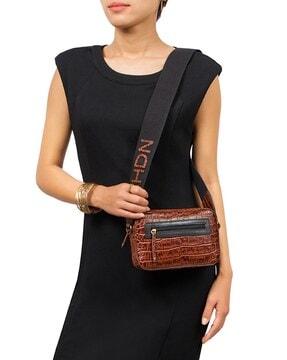 textured handbag with attached strap