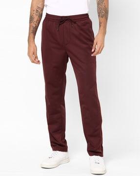 textured mid-rise pants with drawstring waistband