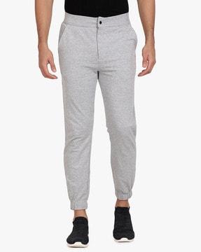 textured mid-rise tapered joggers with pockets