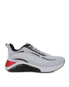 textured running sports shoes with lace fastening