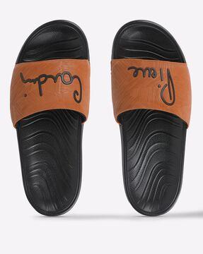 textured slides with logo applique