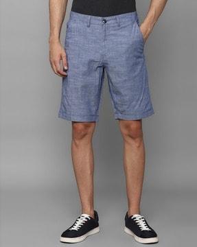 textured slim fit flat-front shorts