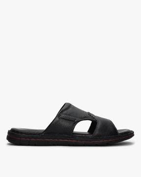 textured slip-on sandals with cutouts