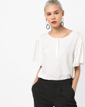 textured top with flared sleeves