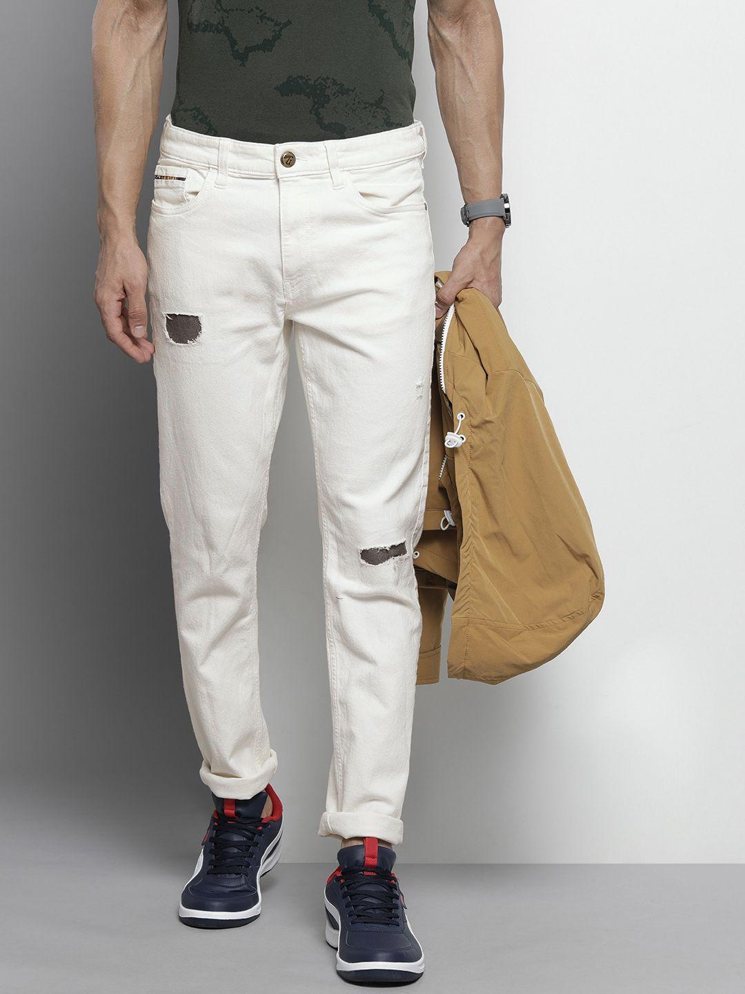 the indian garage co men white slim fit low distress applique stretchable jeans