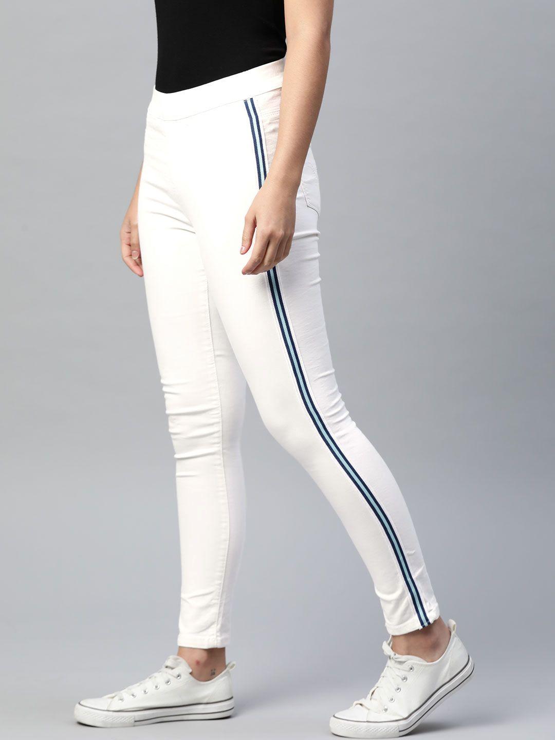 the roadster lifestyle co women white solid jeggings with side stripes