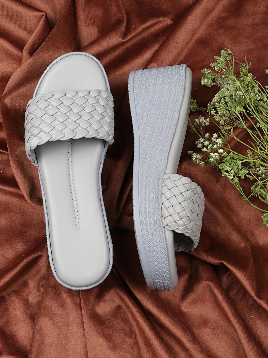 the white pole grey wedge mules