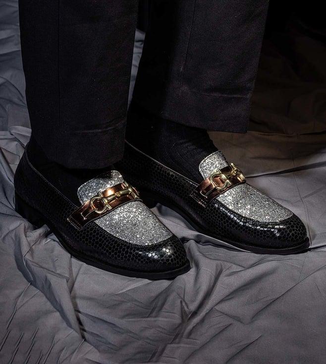 the alternate black shimmery slip ons with buckle detail