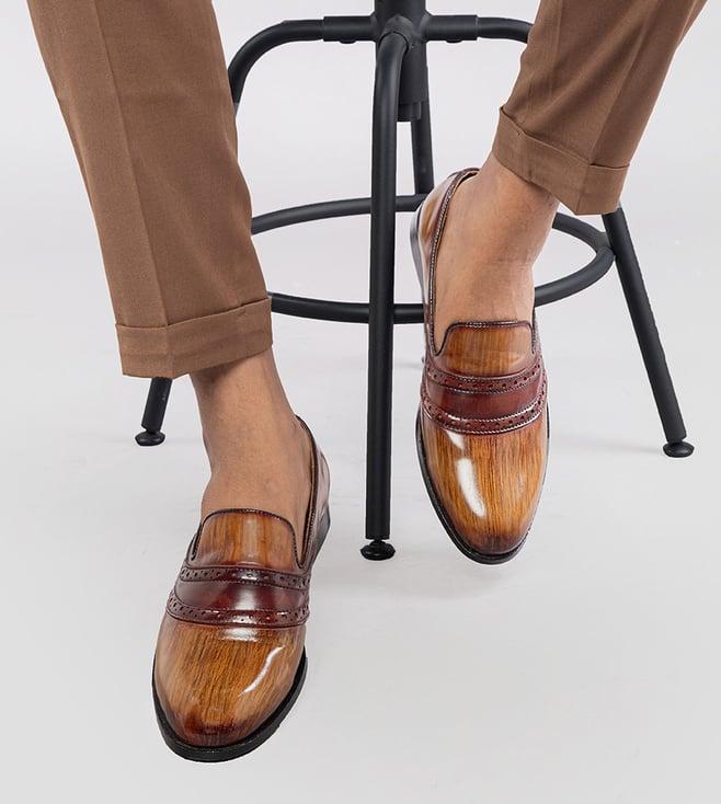 the alternate tan slip-ons with brogue detail