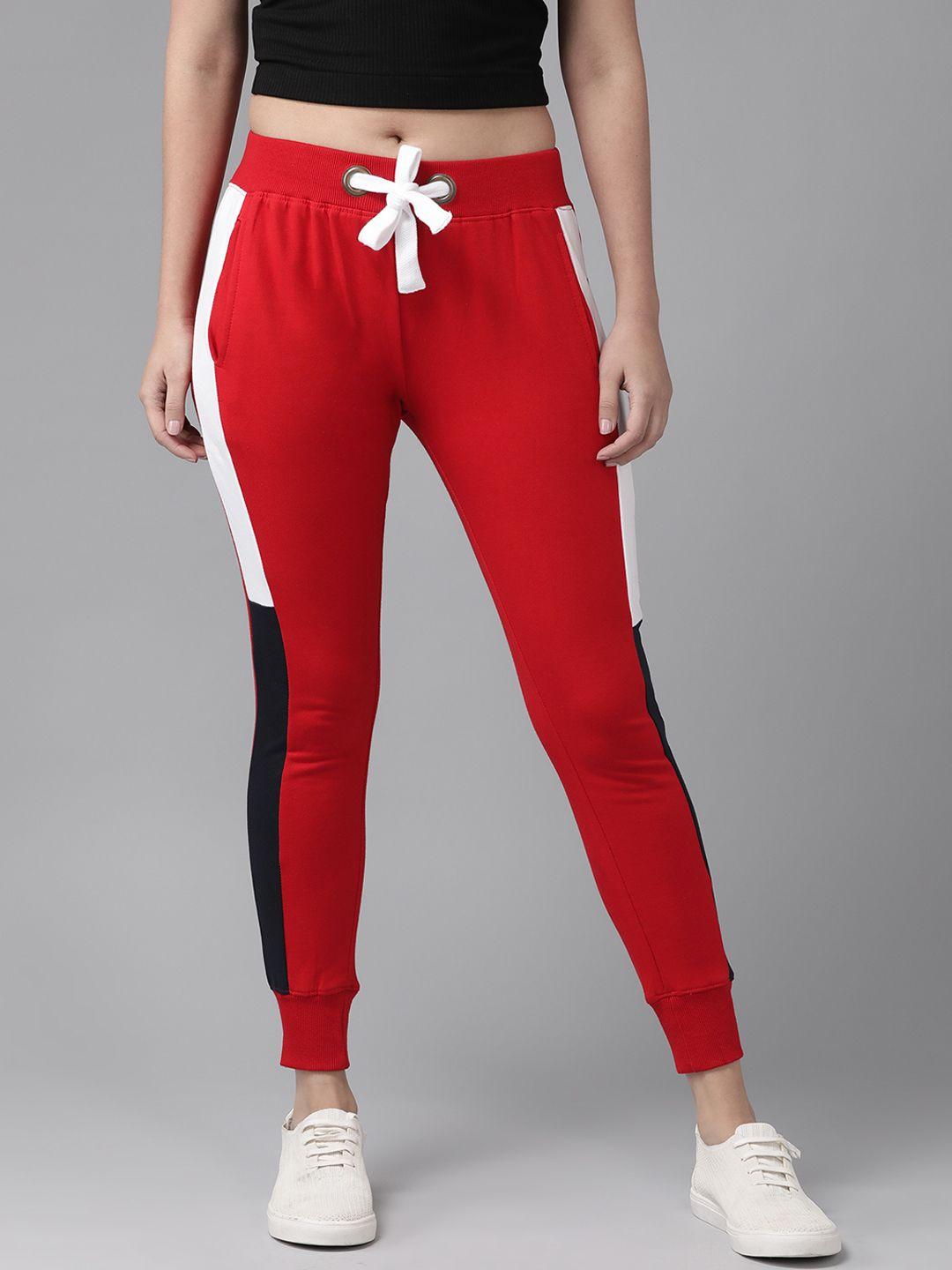 the dry state women red mid-rise joggers with side stripes