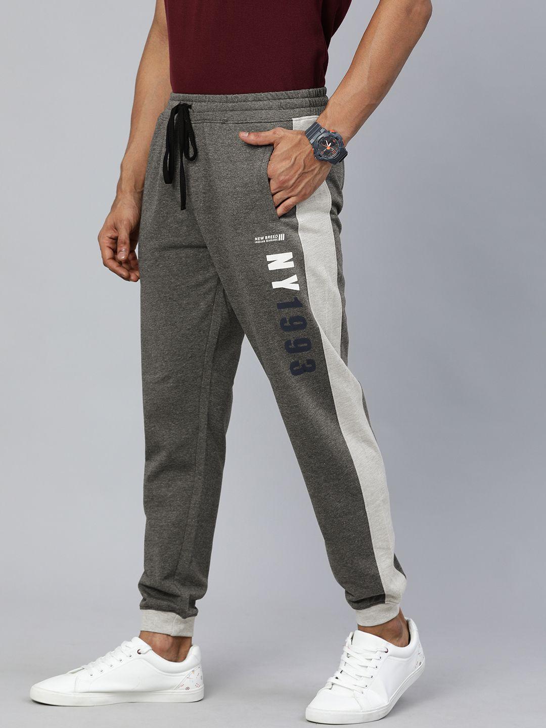 the indian garage co men charcoal grey printed slim-fit joggers with contrast side stripes