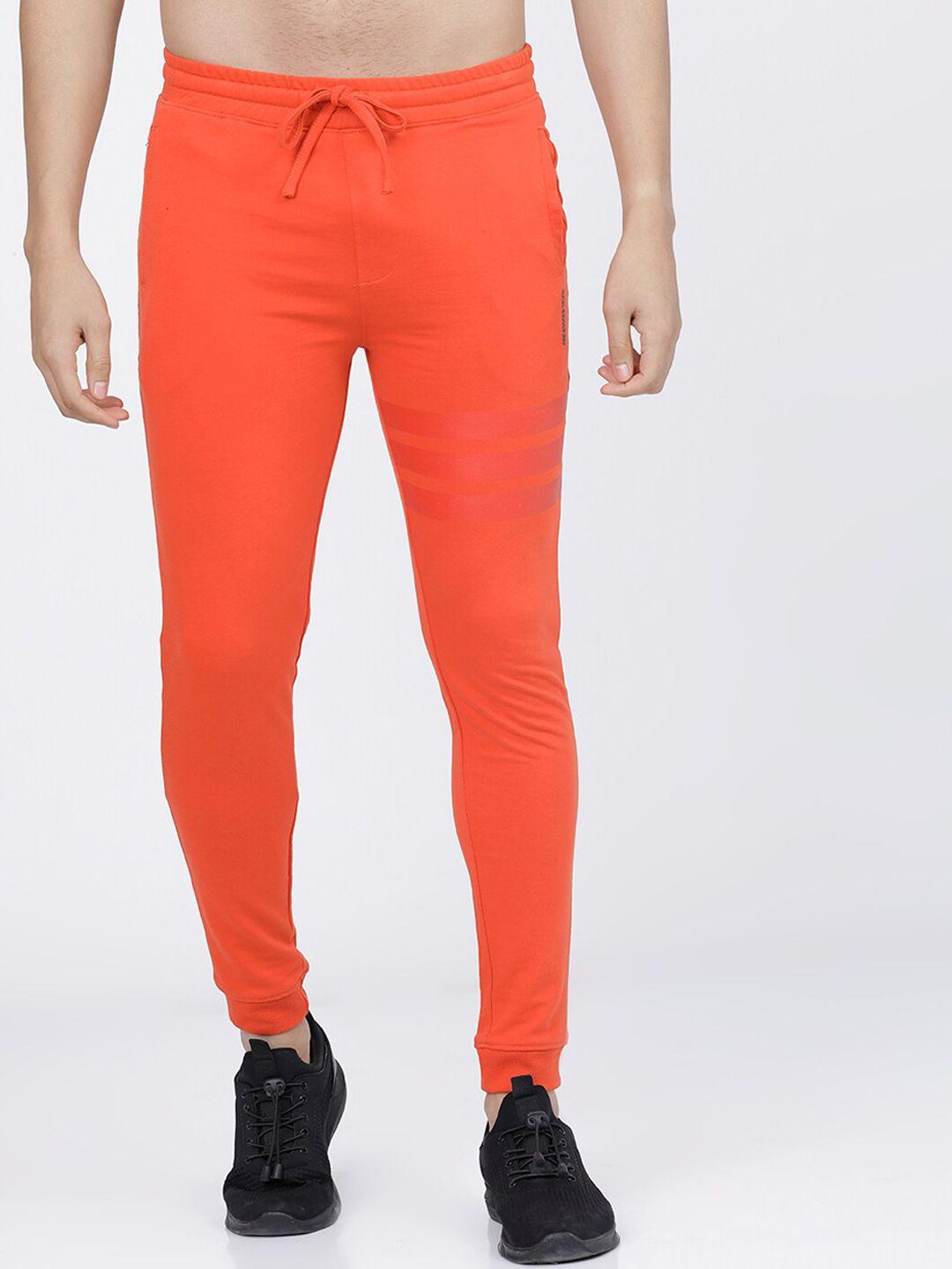 the indian garage co men rust orange solid slim-fit joggers