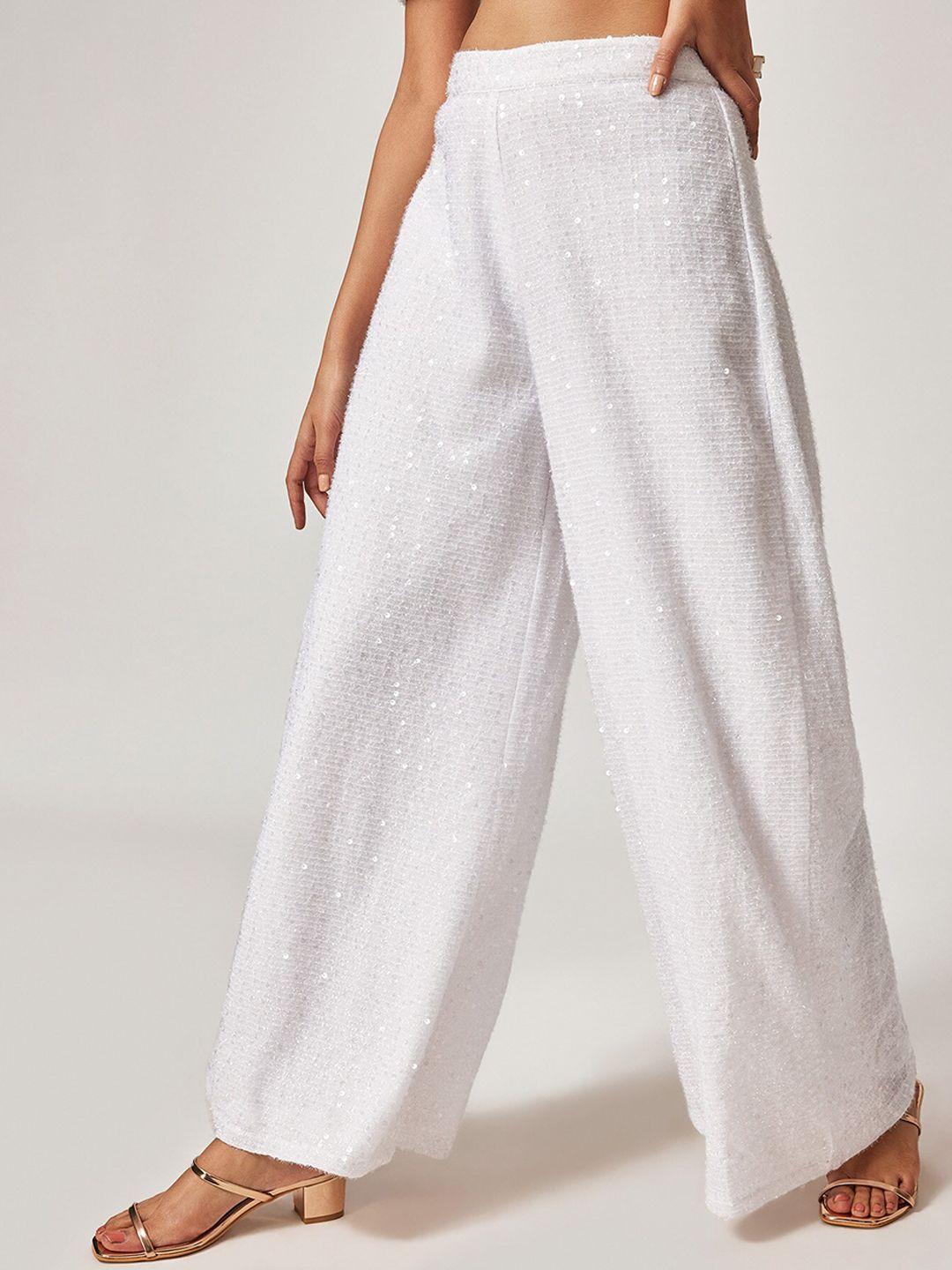the label life women white solid flared low-rise trousers