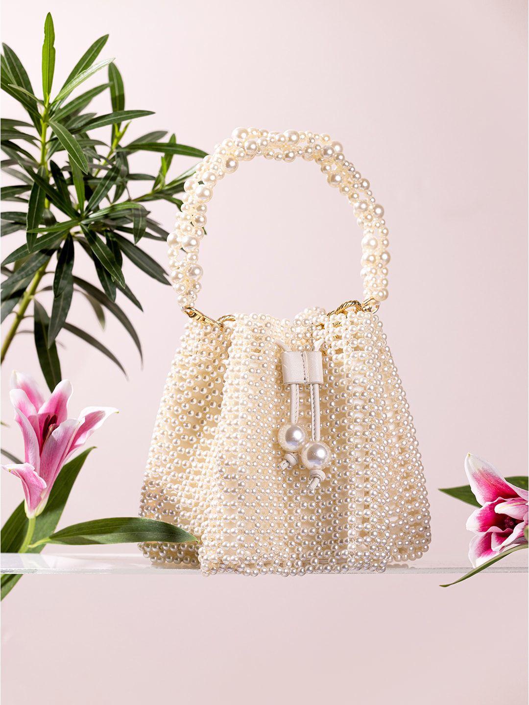 the leather garden embellished leather structured handheld bag