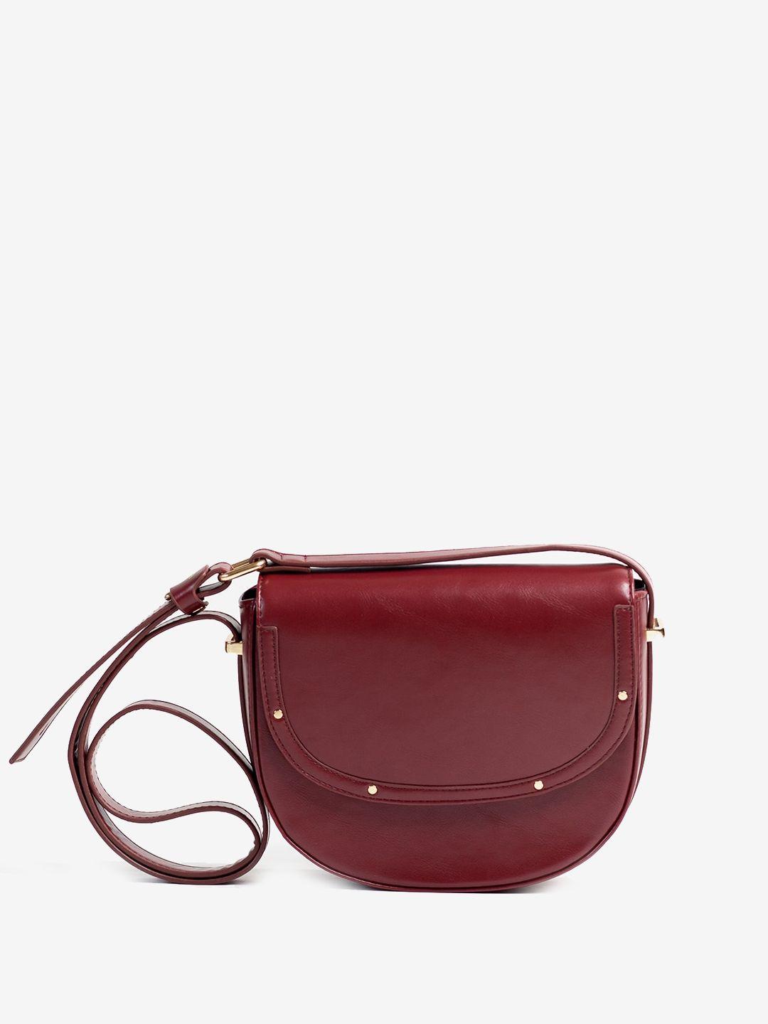 the messy corner half moon sling bag