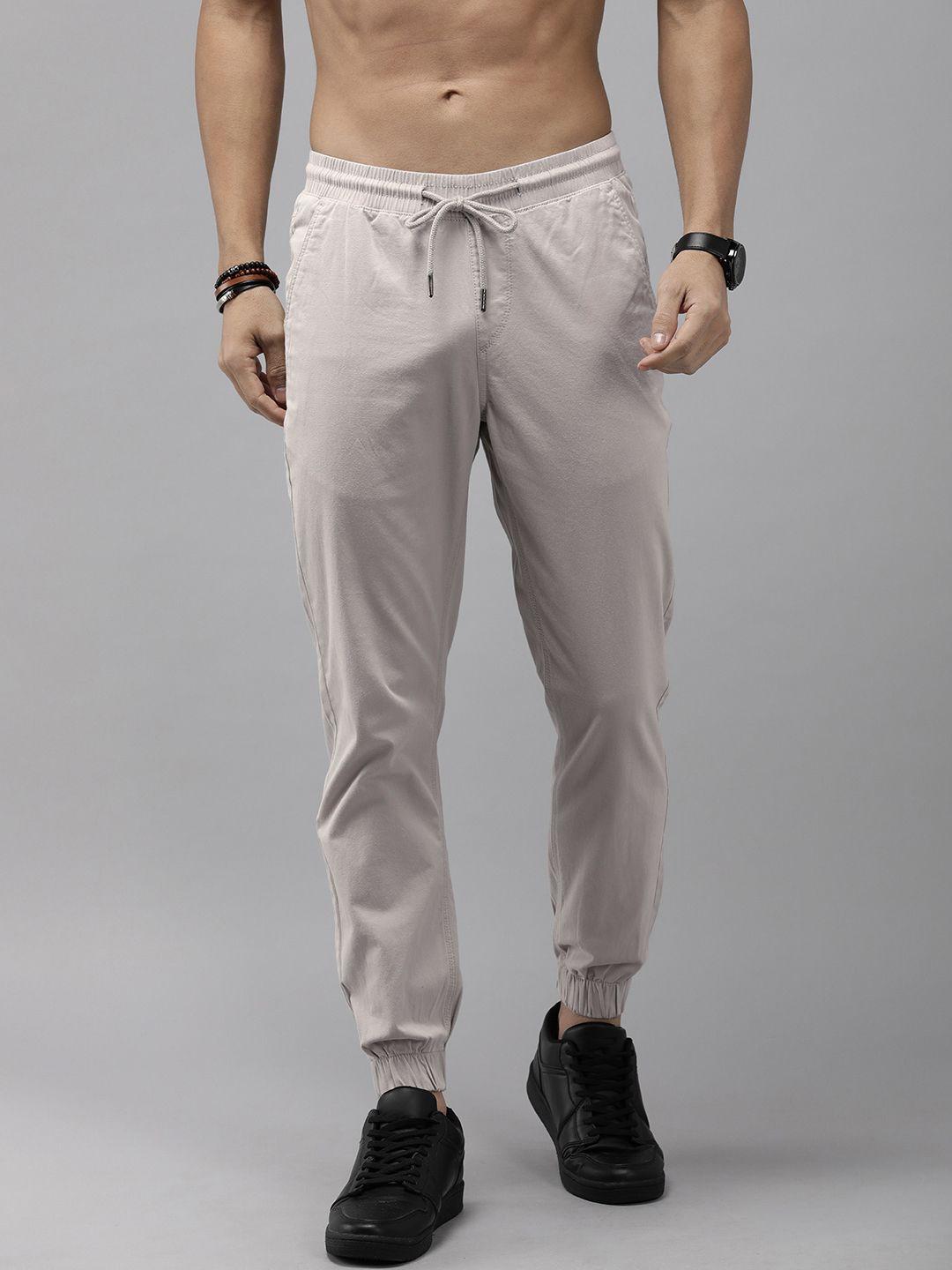 the roadster life co. men solid mid-rise joggers trousers