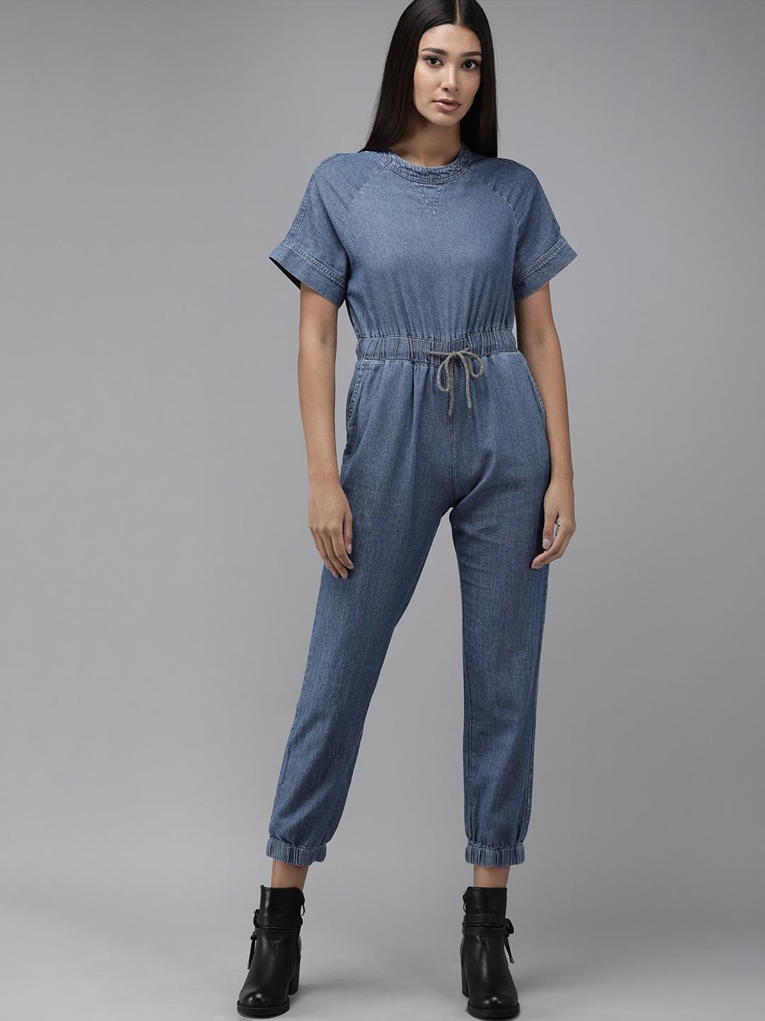 the roadster lifestyle co blue jogger fit basic denim cropped jumpsuit with waist tie-ups