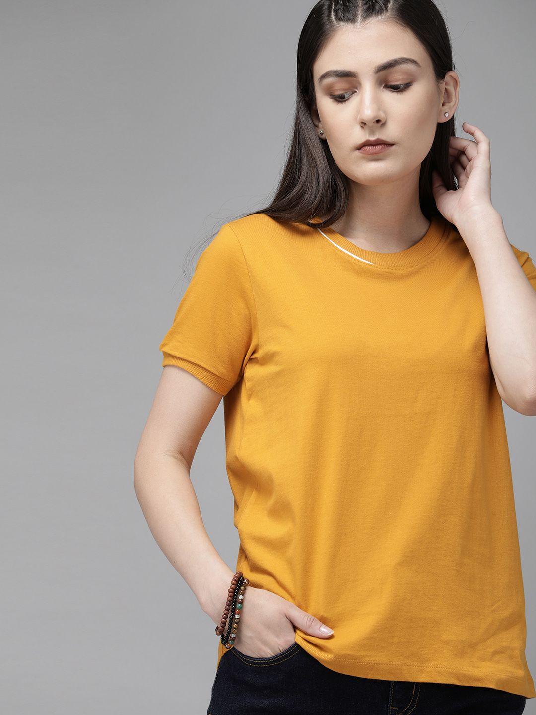 the roadster lifestyle co women mustard solid round neck t-shirt