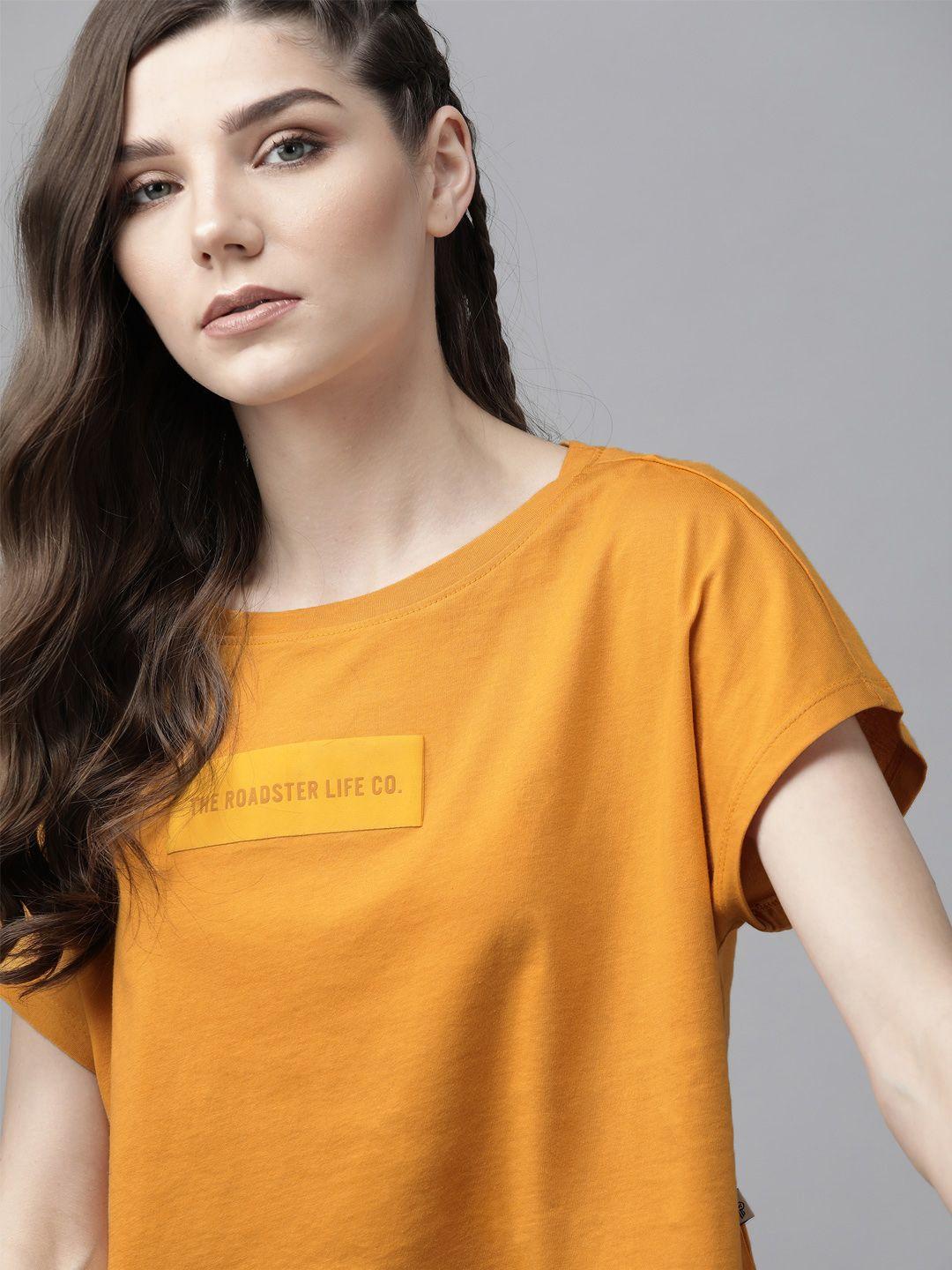 the roadster lifestyle co women mustard yellow brand name print detail cotton round neck boxy t-shirt