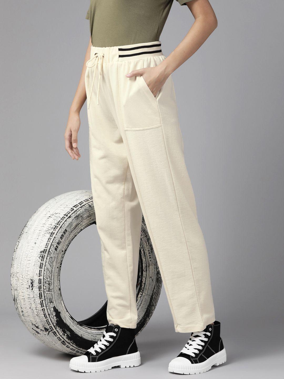 the roadster lifestyle co. women beige solid straight fit track pants