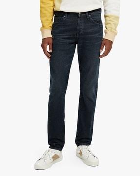 the singel lightly washed slim tapered fit jeans