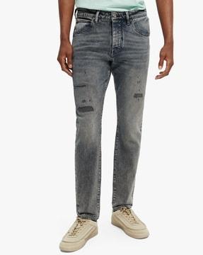 the singel slim tapered jeans