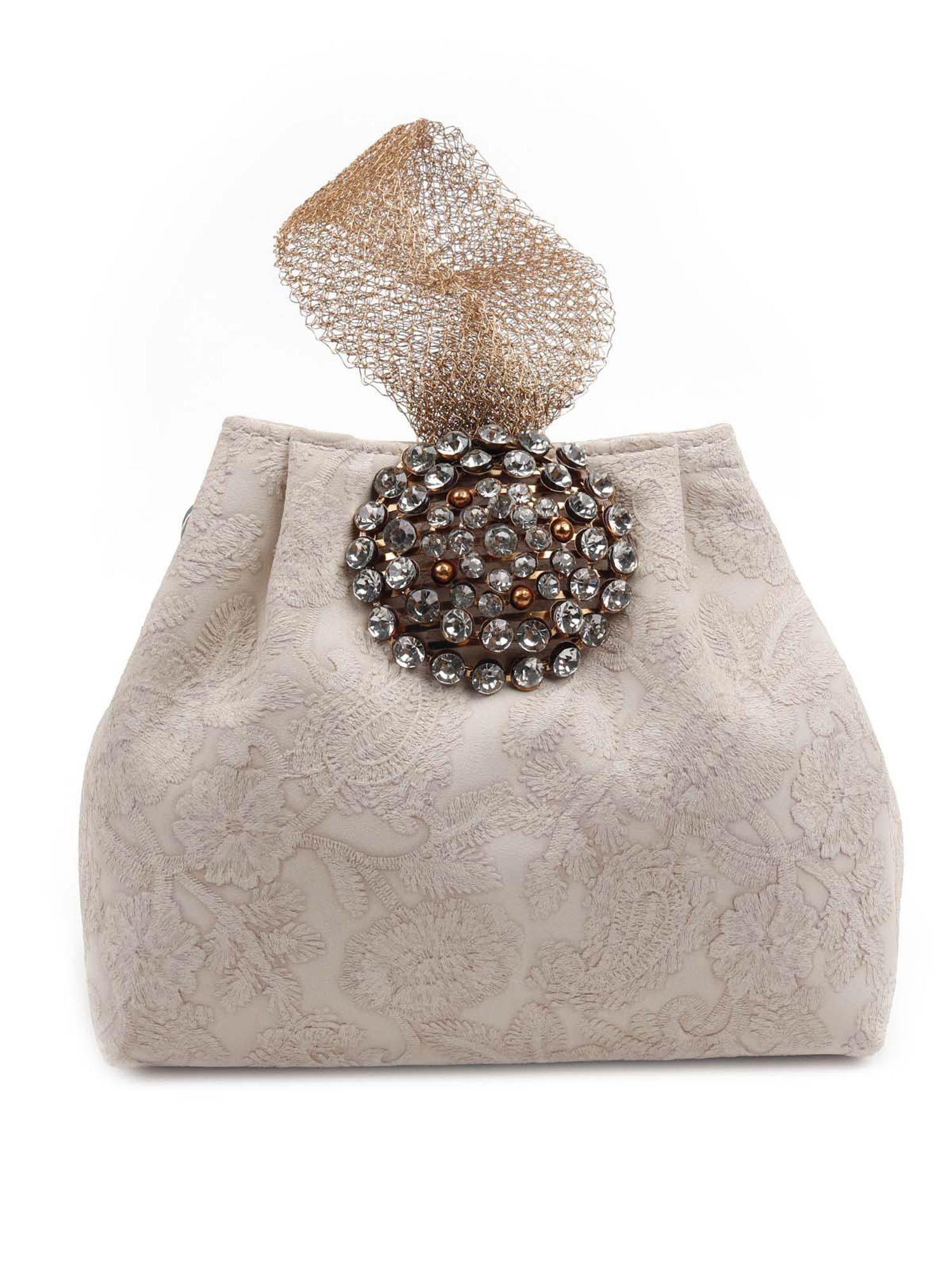 the very stylish beige clutch bag