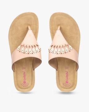 thong-strap wedges with metal studs