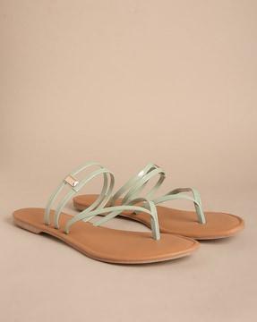 thong-strap flat sandals with metal accent