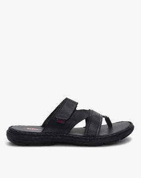 thong-strap flat sandals with velcro fastening