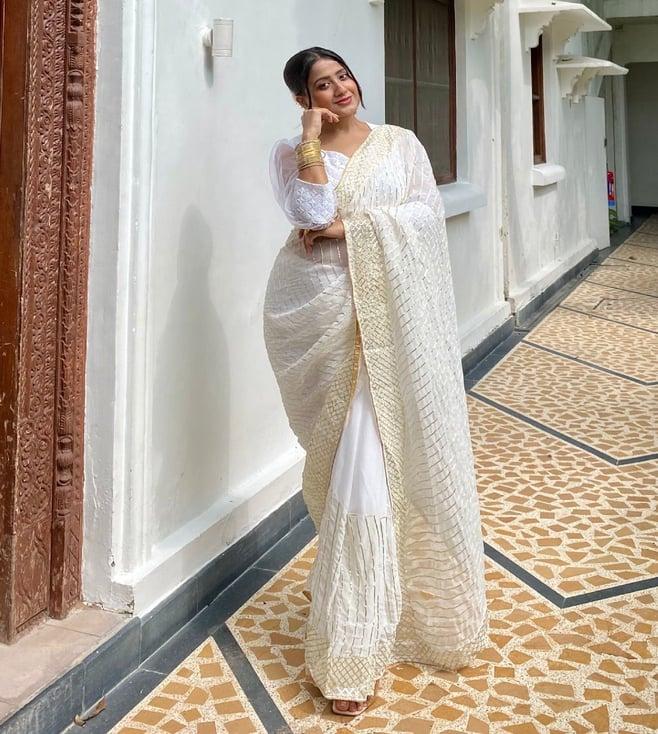 thread and button sand white golden saree