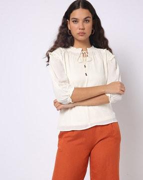 tie-up neck top with ruffle trim