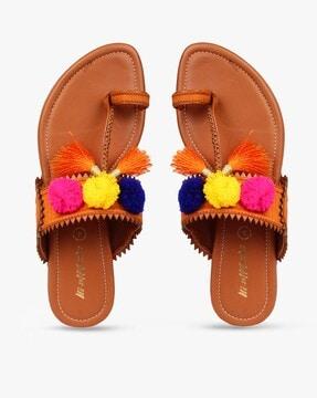 toe-ring flat sandals with pom-pom