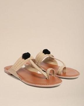 toe-ring flat sandals with pom-poms