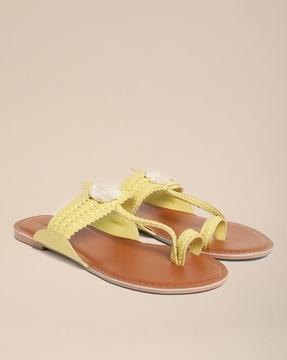 toe-ring flat sandals with pom-poms