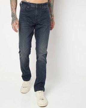 toki in mid-wash slim fit jeans