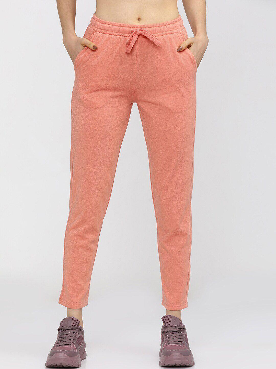 tokyo talkies women peach-coloured solid slim-fit track pants