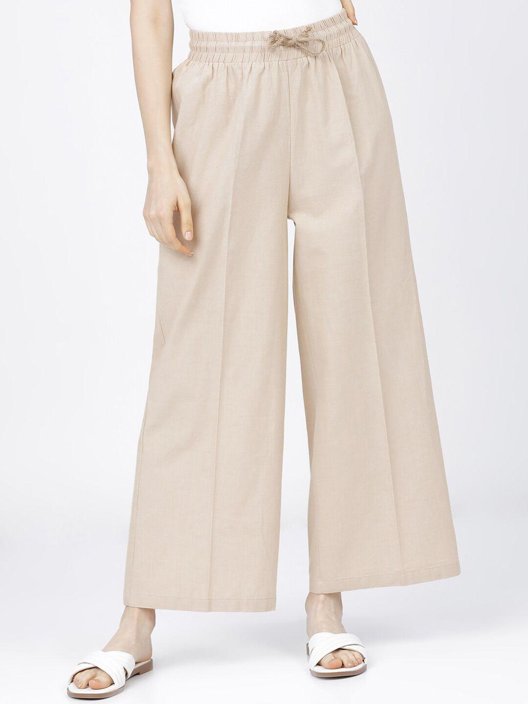 tokyo talkies women beige flared high-rise pleated parallel trousers