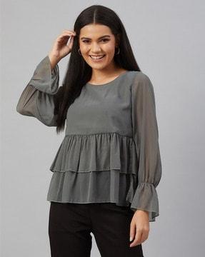 top with ruffle accent