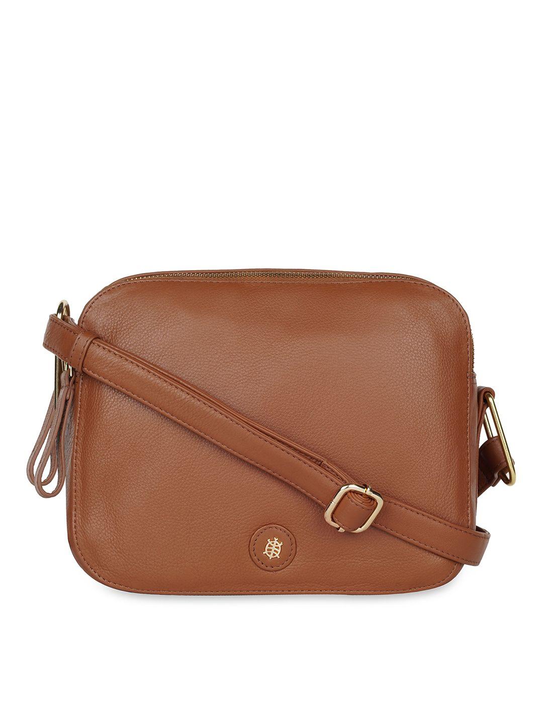tortoise leather structured sling bag with tasselled
