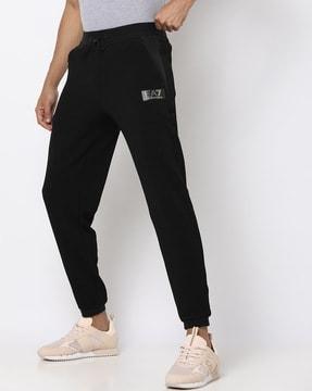 training blended gold logo track pants