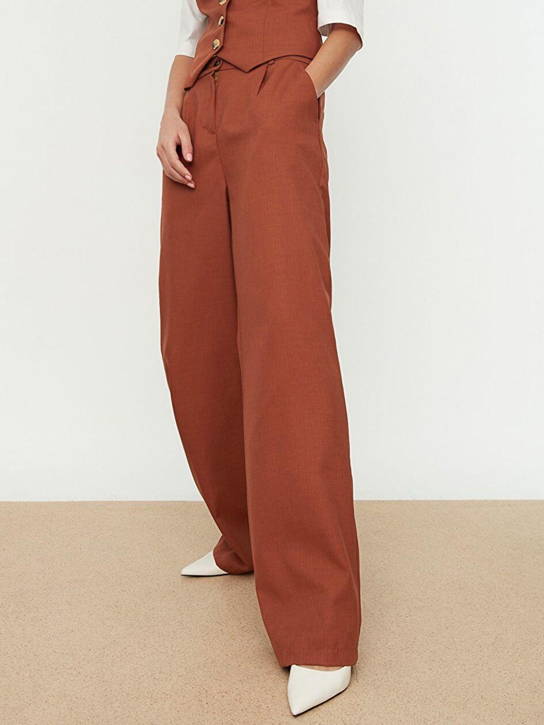 trendyol women rust orange solid high rise parallel woven trousers