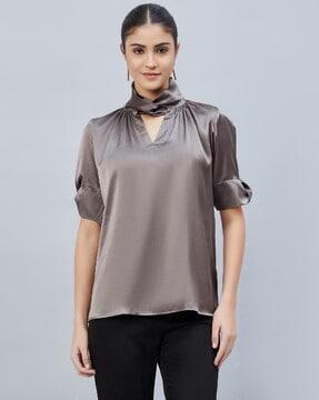 twisted high-neck top with embellished