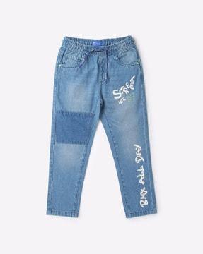 typographic print lightly washed jeans