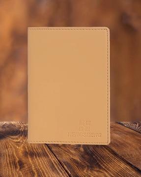 typographic embossed passport holder