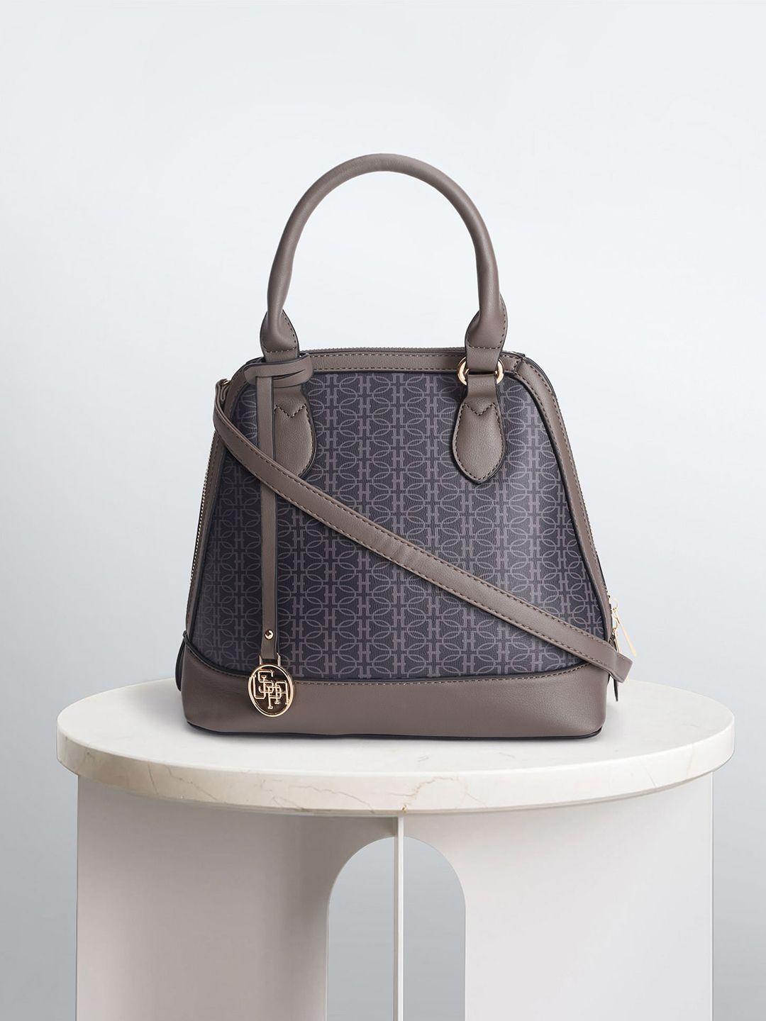u.s.-polo-assn.-women-geometric-printed-structured-handheld-bag-with-tasselled