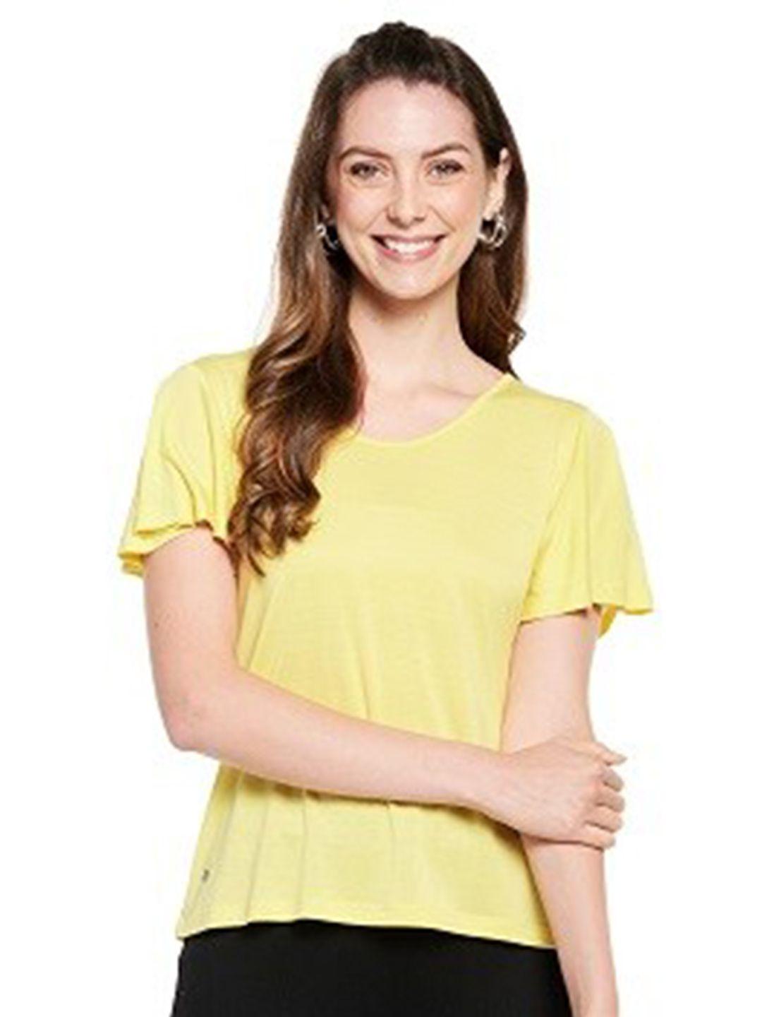 unmade woman yellow top